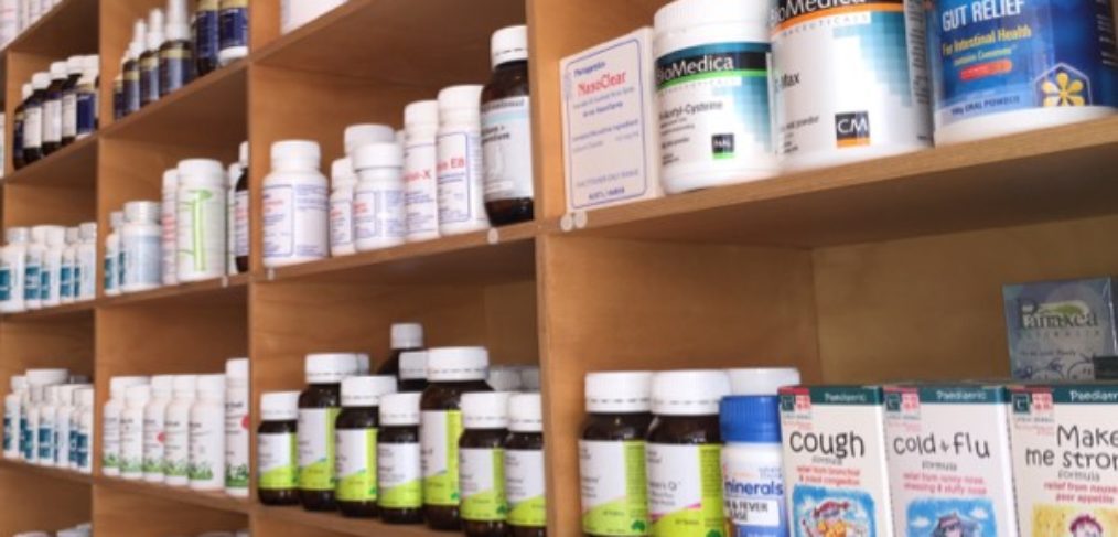 nutritional herbal supplements on a wooden shelf