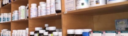 nutritional herbal supplements on a wooden shelf