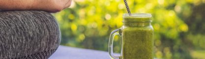 Woman relaxing with a green smoothie