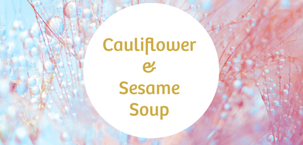 A round text box with the words cauliflower and sesame soup on a light blue and pink background