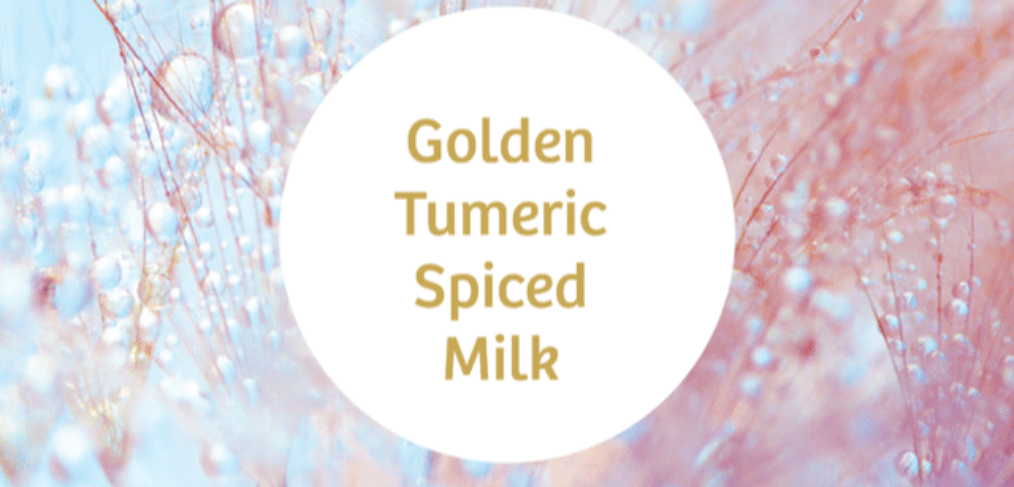 A round text box with the words golden turmeric spiced milk on a light blue and pink background