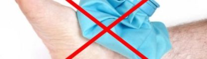Foot with a blue ice bag on it with a big red cross through the whole image